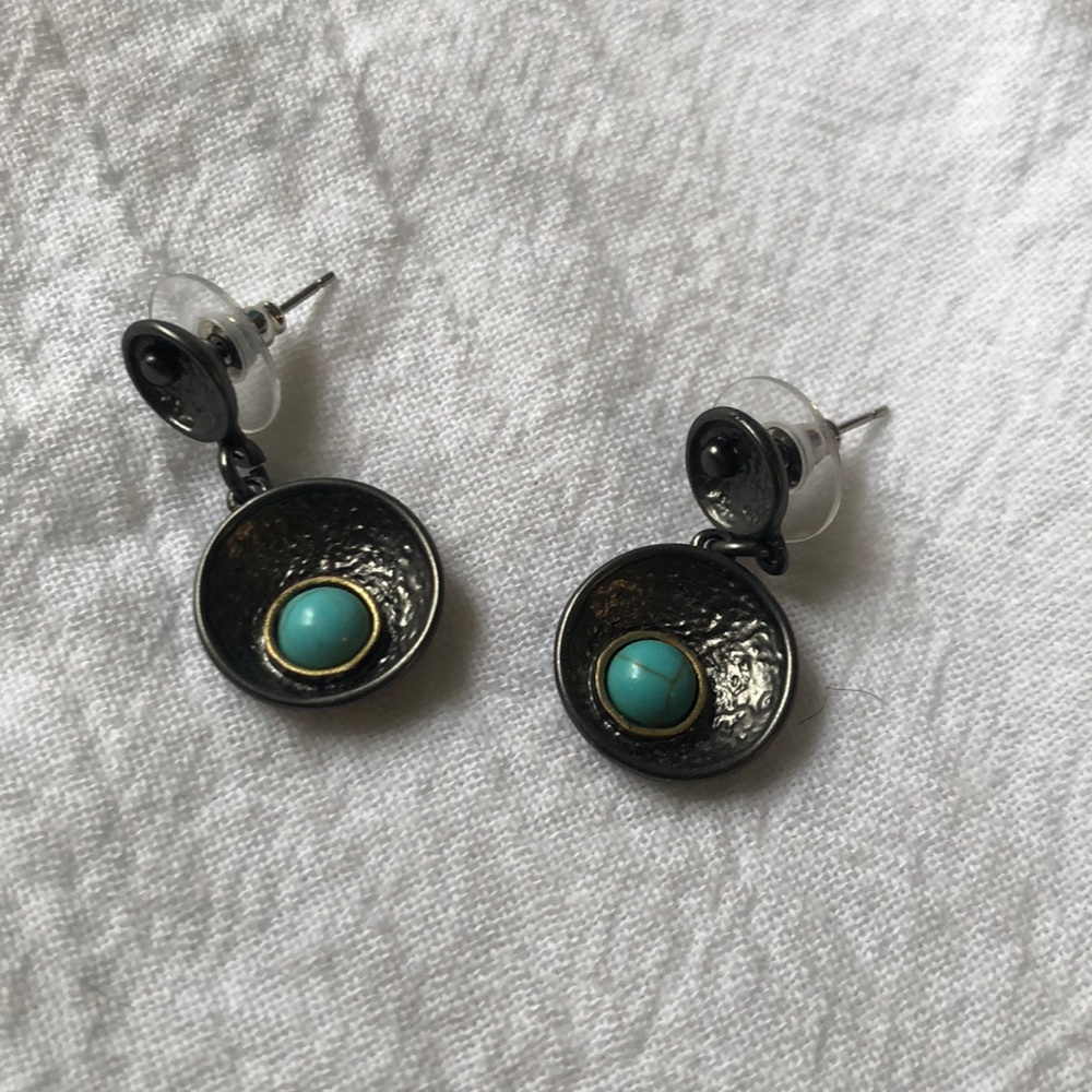 Silver/grey earrings with blue dot.